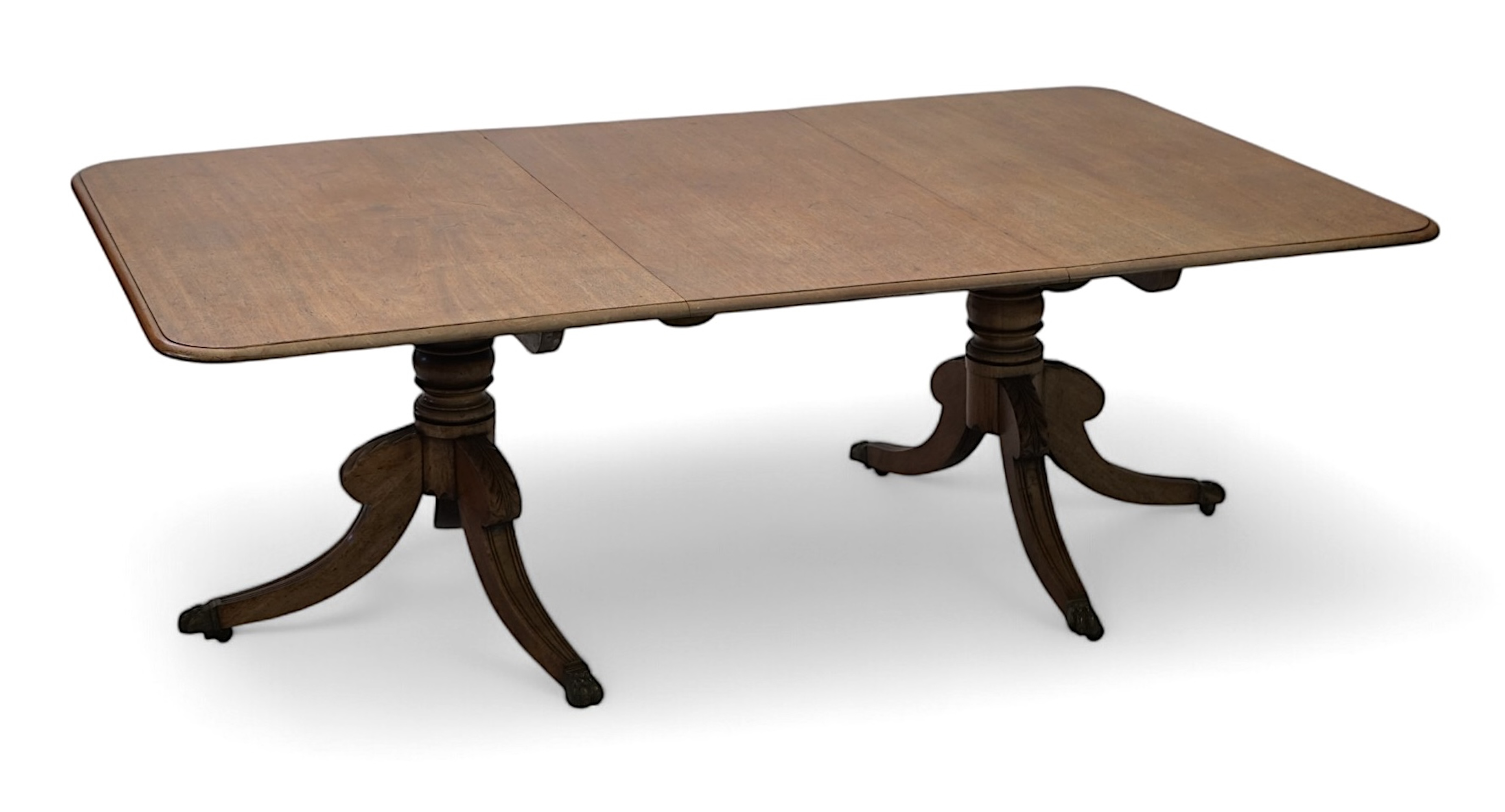 A Regency mahogany extending dining table